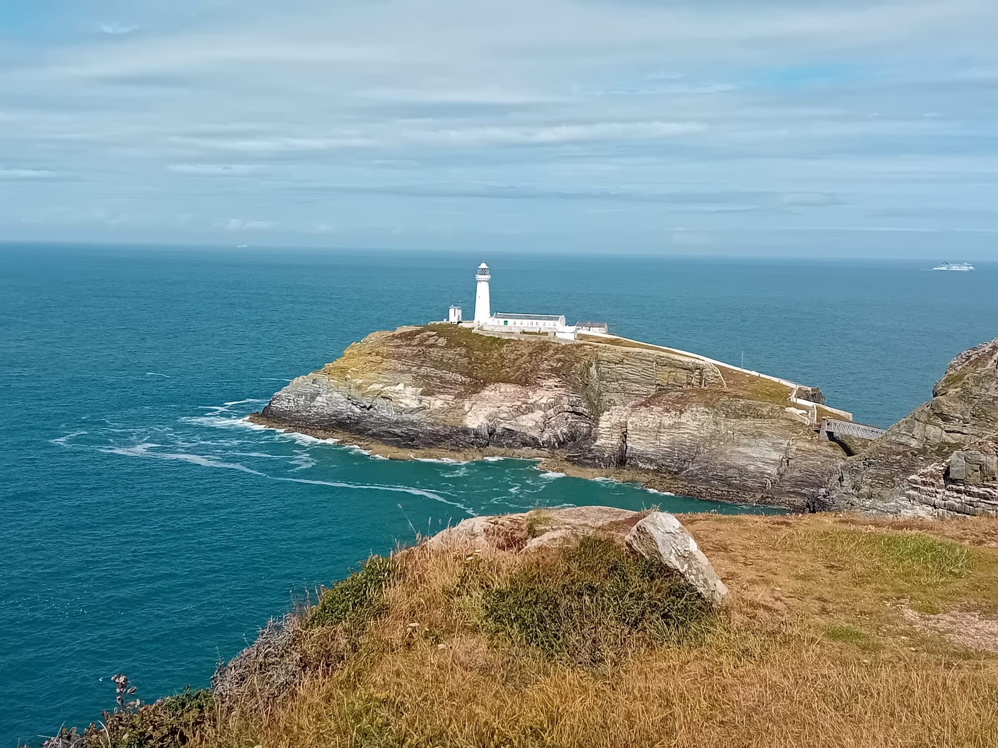 South Stack lighthouse on a headland above the sea in Anglesey
